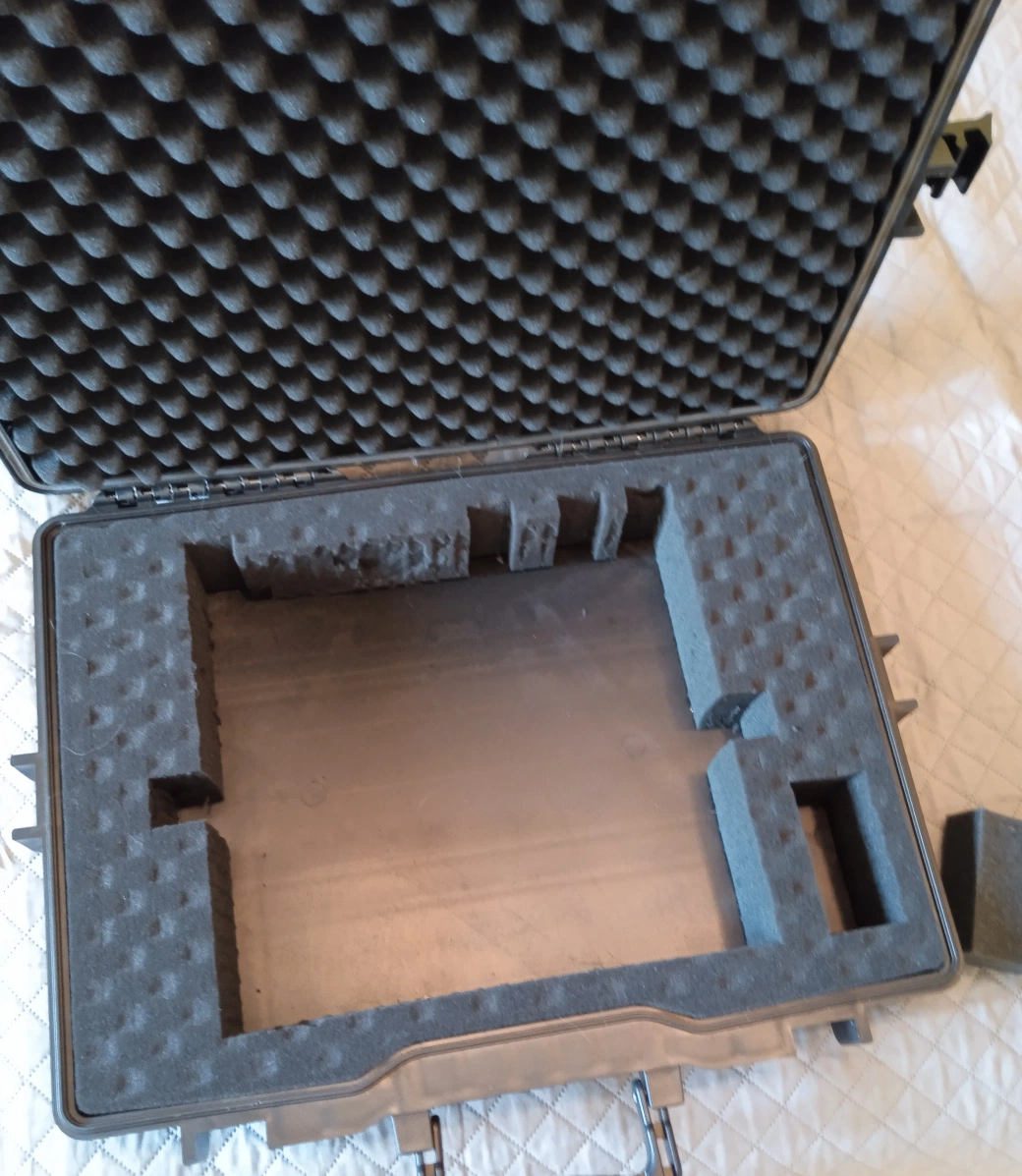 Foam cutout with finger access holes and knob relief cuts added for Maschine MK3 extraction and protection