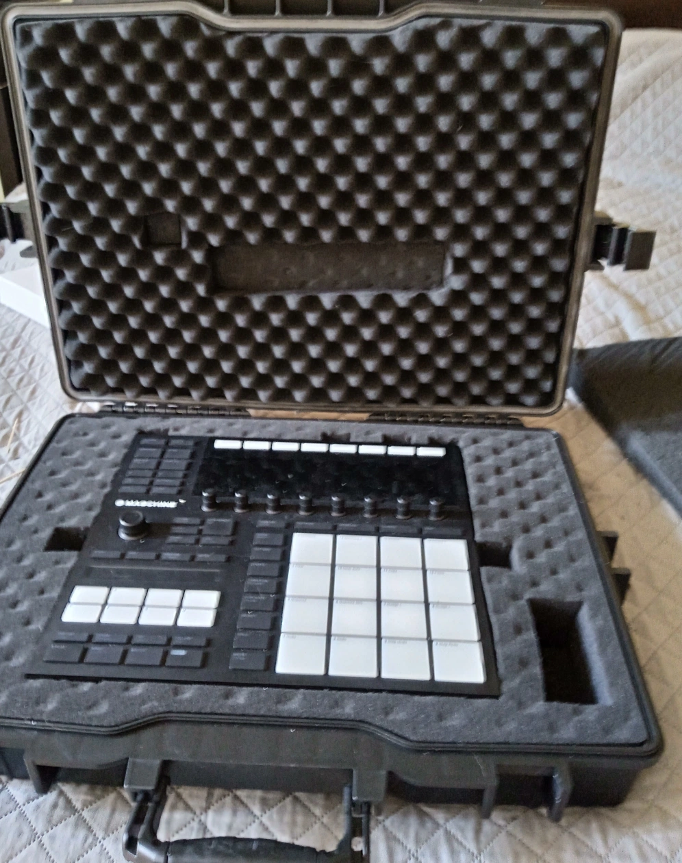 Completed DIY hermetic tool case with custom angled foam cutout holding Maschine MK3 — finished build